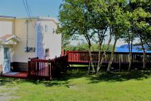 Private front entrance. 3 large, intersecting, gated patios with ocean view